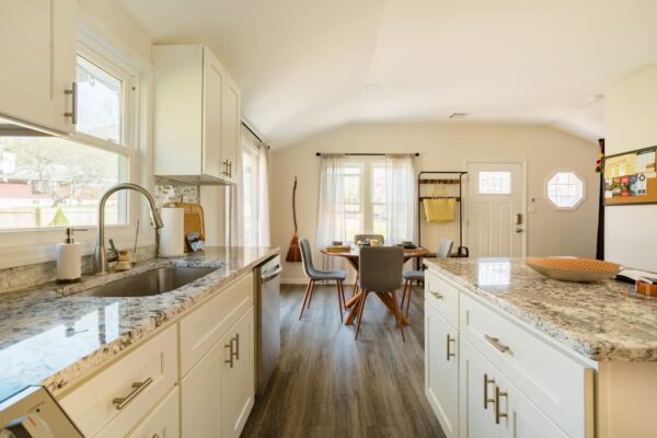 Renovated kitchen with granite counters and new appliances