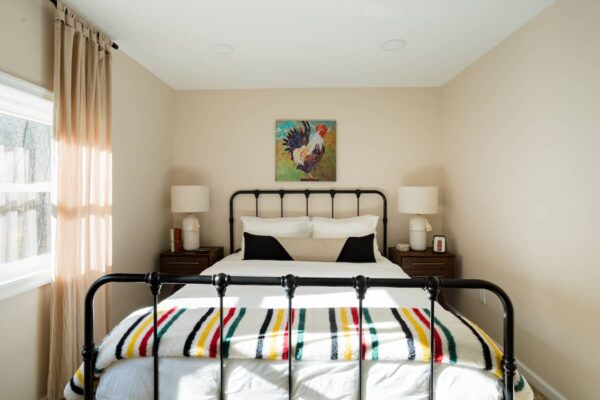 Queen bedroom with a striped wool blanket
